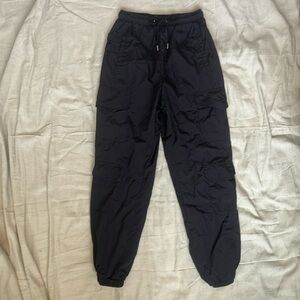 Black track pants with plenty of pockets